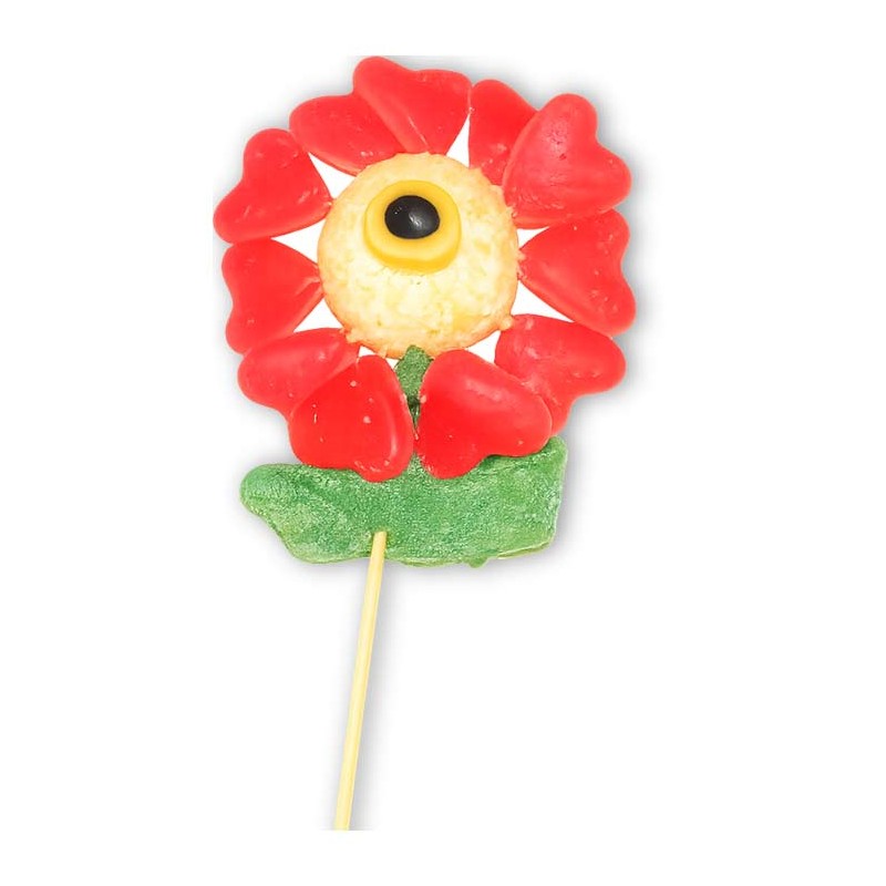 Fleur en bonbons sur boule coco – pétales cœur rouges, centre œil, feuilles gélifiées vertes